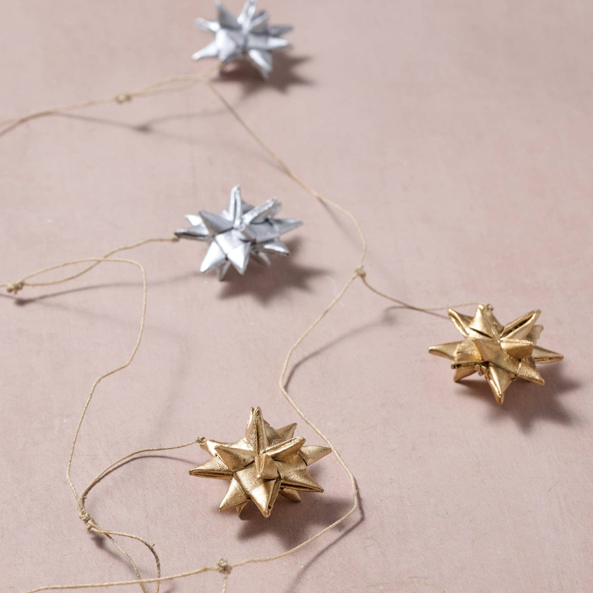 Veda Silver + Gold Metallic Star Palm Leaf Garland